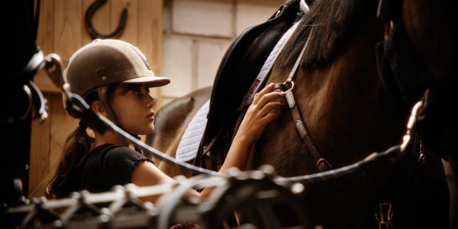 Rider preparing a horse at Gintarinė Pasaga